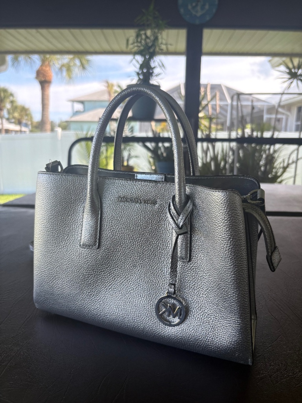 Michael Kors, mid-size, silver purse.